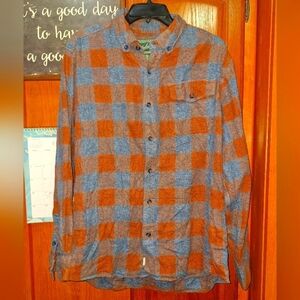 A vintage Woolrich Blue and Brown Checkered Button-Up Shirt in a size large. EUC